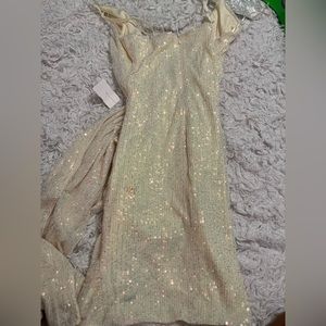 Holographic white sequined formal dress.